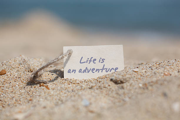 istock Message Life is an adventure on the sand 587802510
