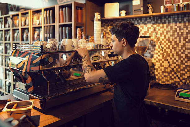 istock Barista at work in a coffee shop 587804412