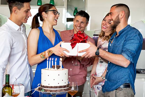istock Man Giving present during a Birthday party 587804424