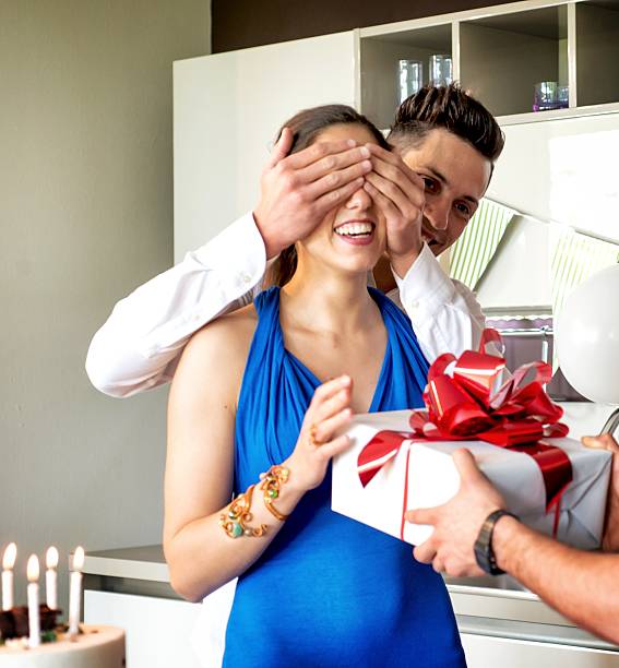 istock Man Giving present during a Birthday party 587804718