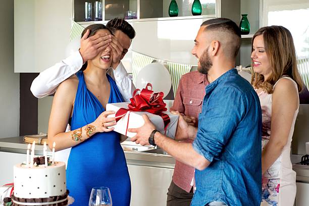 istock Man Giving present during a Birthday party 587804950