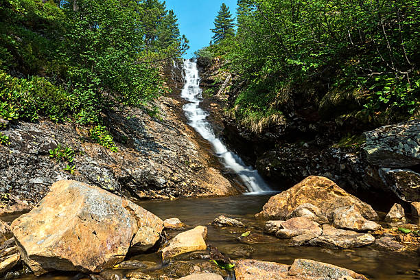 istock Waterfall on a mountain stream in Khamar-Daban ridge 587805074