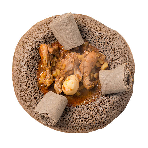 Ethiopian injera with chicken isolated on white.