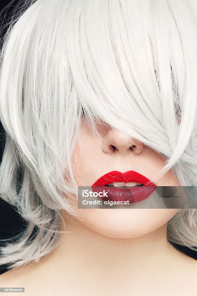 Grey hair and red lipstick Close-up portrait of young woman with red lipstick and manga haircut White Hair Stock Photo