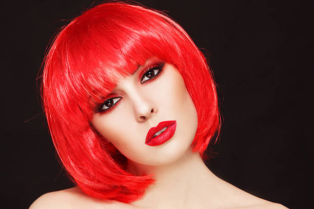 istock Girl in red wig 587807156