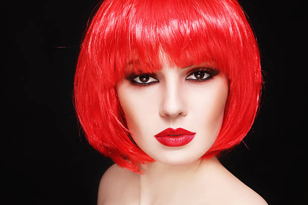 istock Girl in red wig 587807298