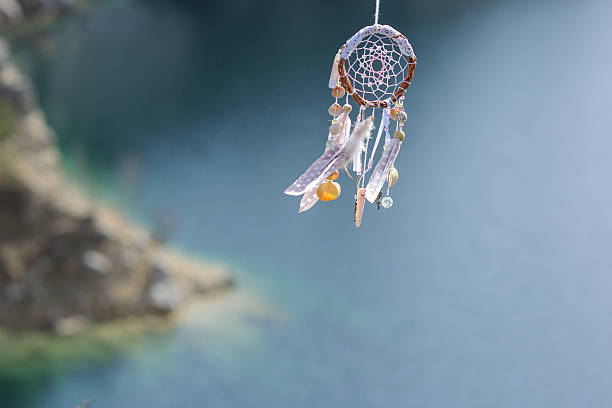 istock Handmade native american dream catcher on background of rocks an 587809290