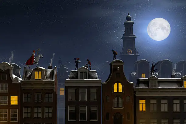 Photo of Sinterklaas and the Pieten on the rooftops at night