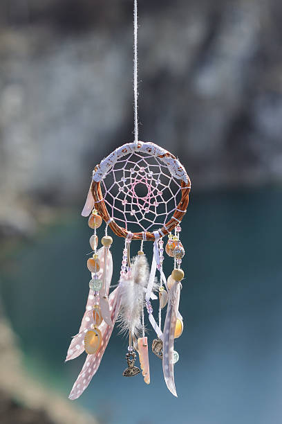 istock Handmade native american dream catcher on background of rocks an 587809488