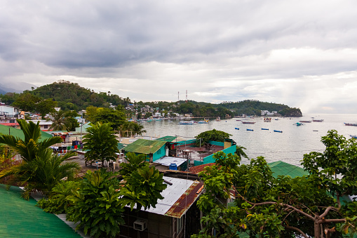 Puerto Galera, Philippines - May 14, 2012: View of the houses on the coast of Sabang Beach in Puerto Galera, Philippines.
