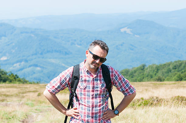 istock Mountaineer feeling tired after climbing on top 587811702