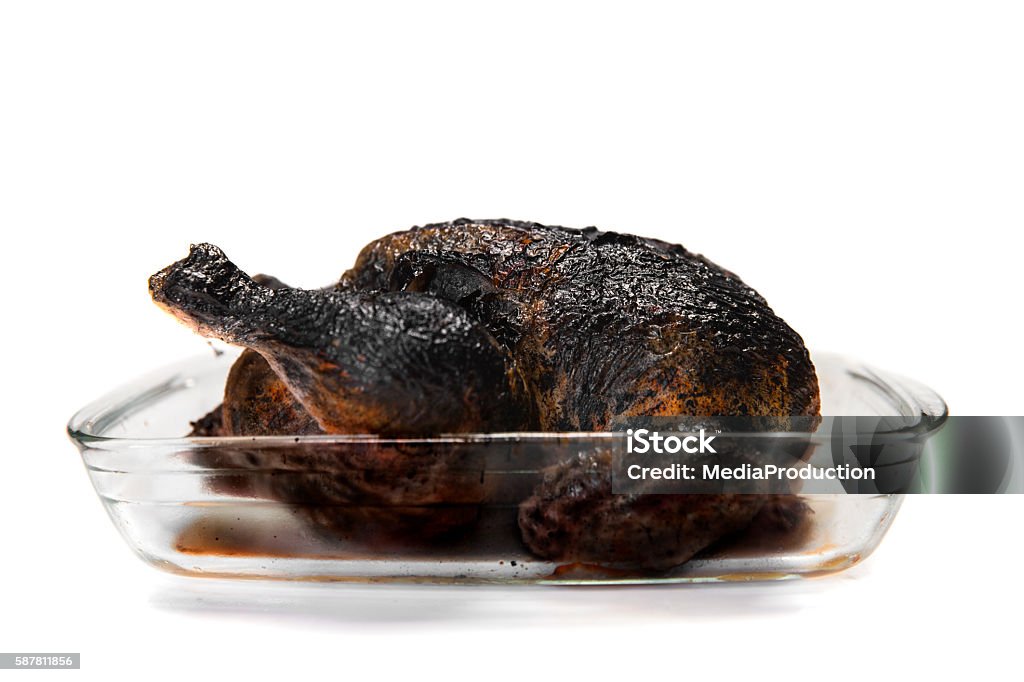 Burnt Chicken on white Burnt Stock Photo