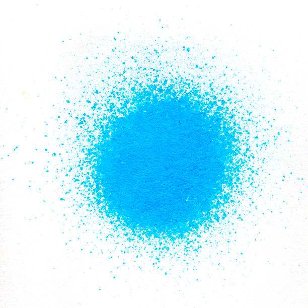istock Color pigment sprinkles on white paper 587812068