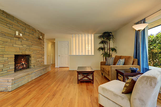 istock Nice living room in brown colors with stone wall 587812564