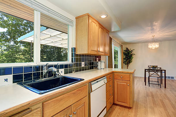 istock Kitchen room interior with cabinets and tile back splash trim 587812804