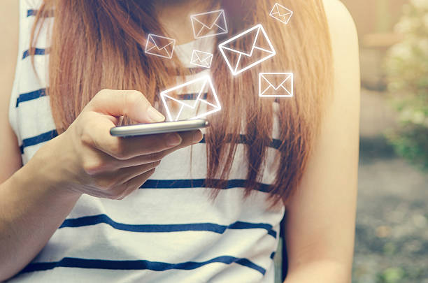 Woman sending Email or Message on mobile smartphone.