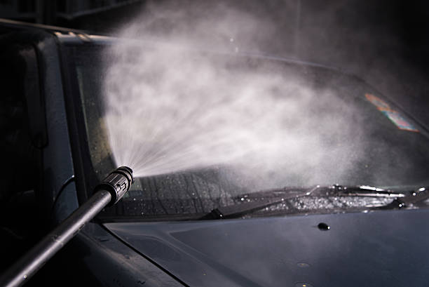 istock car washing cleaning with foam and hi pressured water/selective 587814402
