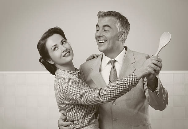 Vintage couple dancing in the kitchen