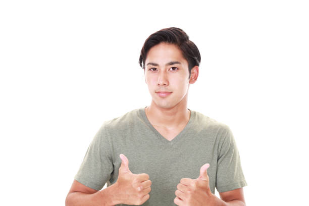 istock Asian man showing thumbs up sign 587815820