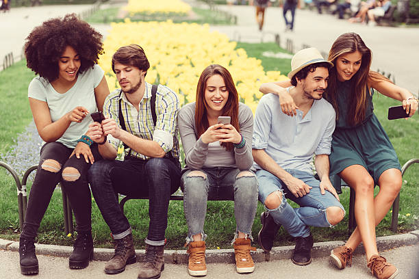 istock Group of friends in the park 587816642