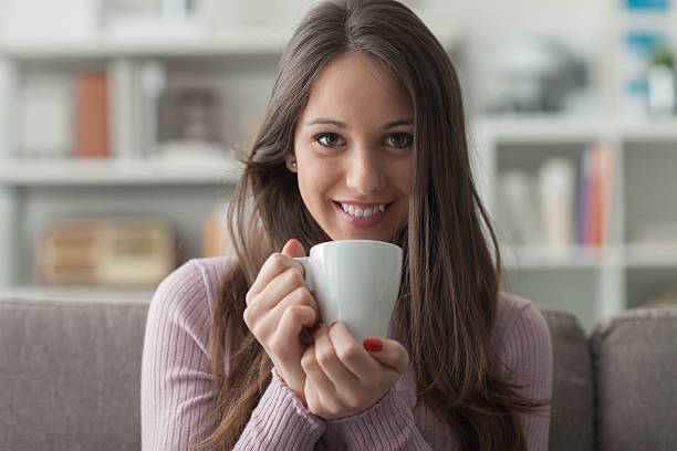 istock Girl having a coffee at home 587817706