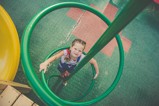 istock Beautiful cute girl on a playground 587817870