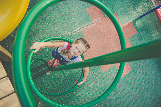 istock Beautiful cute girl on a playground 587817940