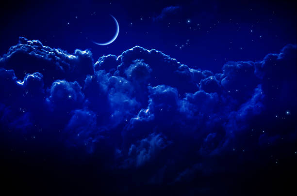 istock Night Sky with Stars and Clouds 587818622