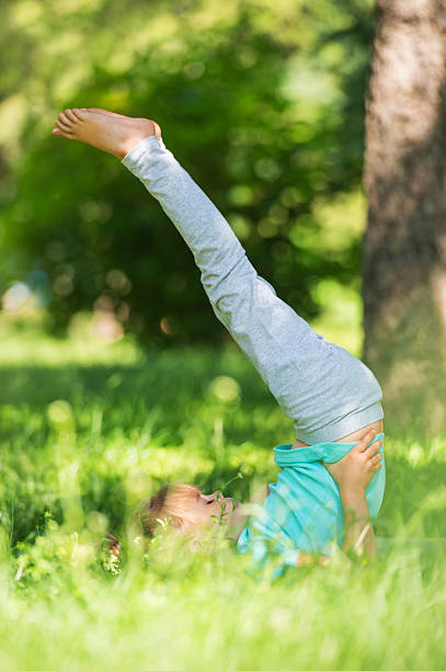 istock Little girl doing gymnastic exercises 587818964