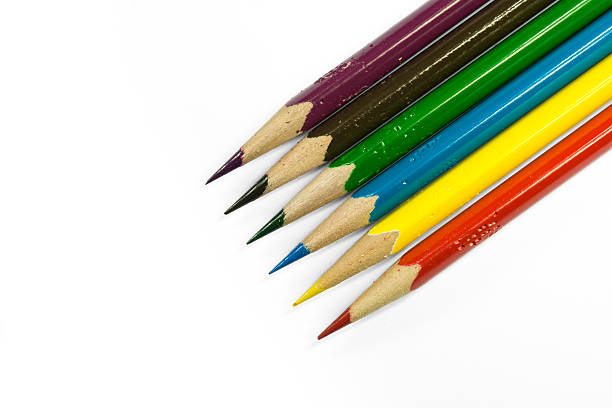 istock Sharp colorful wooden pen and white background 587878608