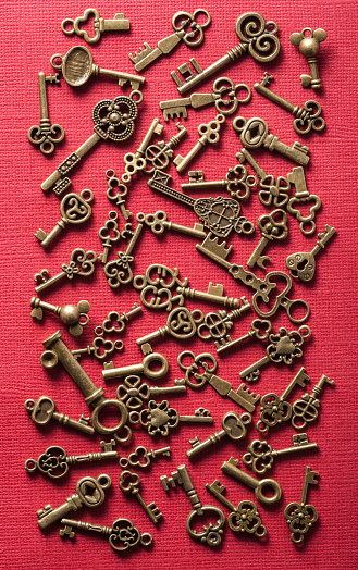 Closeup  on an old keys on a red background.