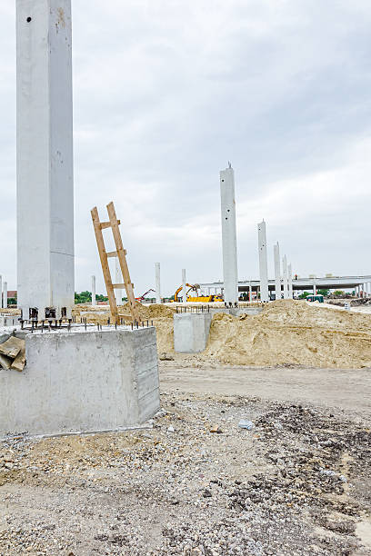 istock Giant reinforced concrete column with used wooden ladders 587879216
