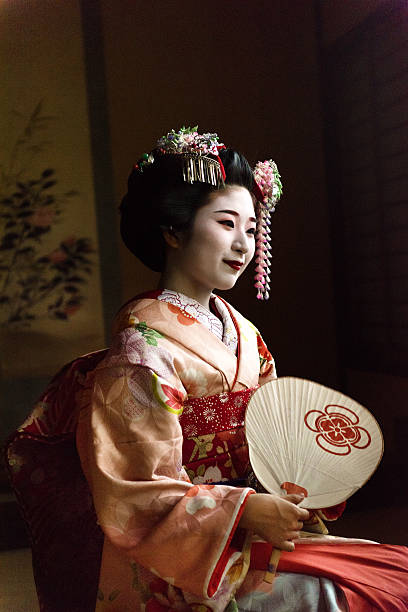 istock Maiko holding a hand fan 587880142