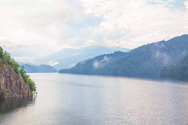 istock mountain lake and fog 587881220