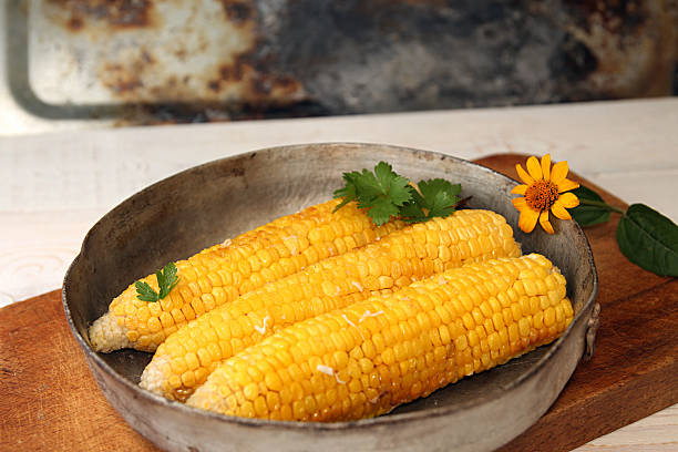 istock Corn baked in oven with butter and garlic 587881366