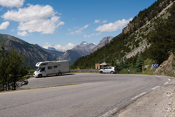 istock Caravan on the road in the Alps 587882118