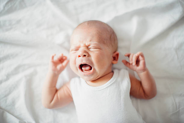 istock newborn baby boy crying 587883262