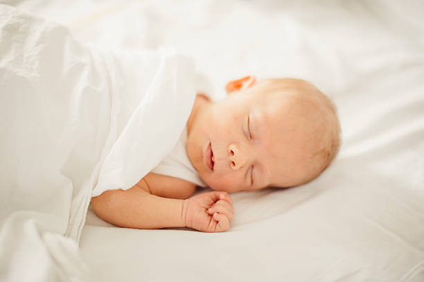 istock newborn baby boy sleeping 587884144