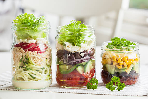 istock healthy vegetable cheese salad in mason jars 587884258