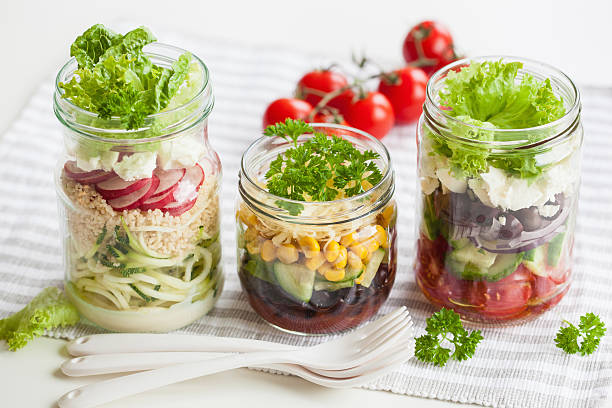 istock healthy vegetable cheese salad in mason jars 587884320