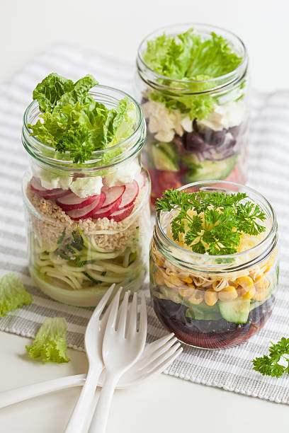 istock healthy vegetable cheese salad in mason jars 587884400