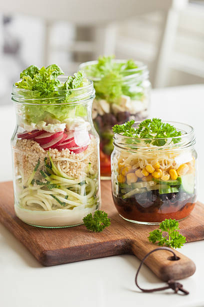 istock healthy vegetable cheese salad in mason jars 587884494
