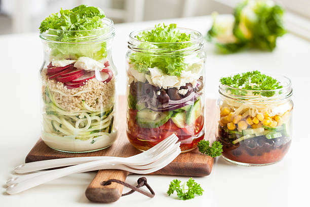 istock healthy vegetable cheese salad in mason jars 587884604