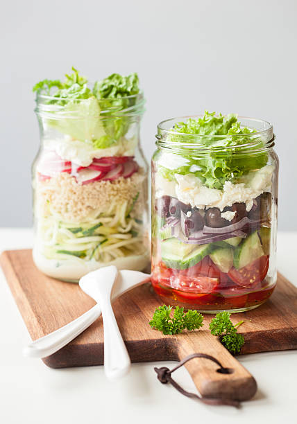 istock healthy vegetable cheese salad in mason jars 587884674