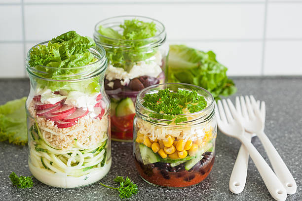 istock healthy vegetable cheese salad in mason jars 587884788
