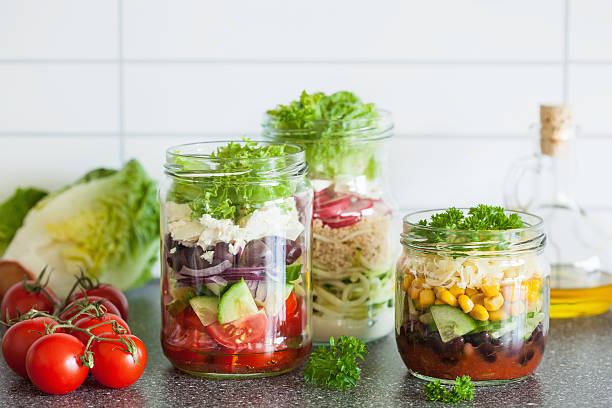 istock healthy vegetable cheese salad in mason jars 587884902