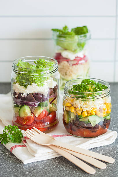istock healthy vegetable cheese salad in mason jars 587884978