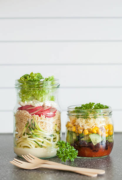 istock healthy vegetable cheese salad in mason jars 587885106