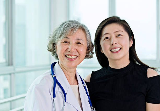 istock Senior female doctor with her patient 587885954