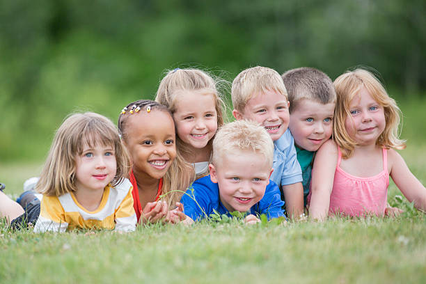 istock Dog Pile in the Grass 587887136